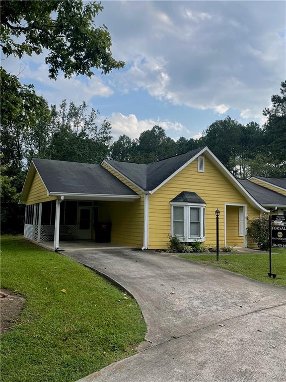 101 Villas Lane Rome, GA 30165 - Photo 1 of 1 a front view of a house with a garden and trees