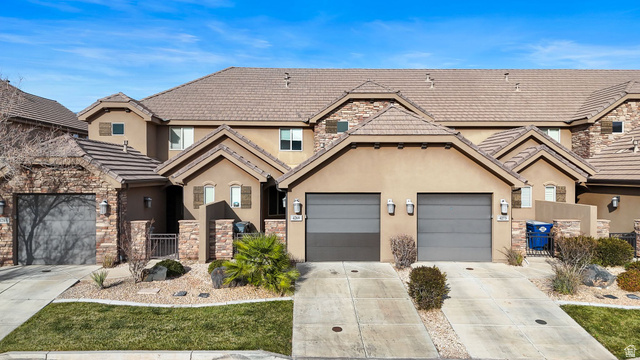 4269 Razor Drive Washington, UT 84780 - Photo 37 of 50 View of front facade with concrete driveway, stucco siding, stone siding, a gate, and a tile roof