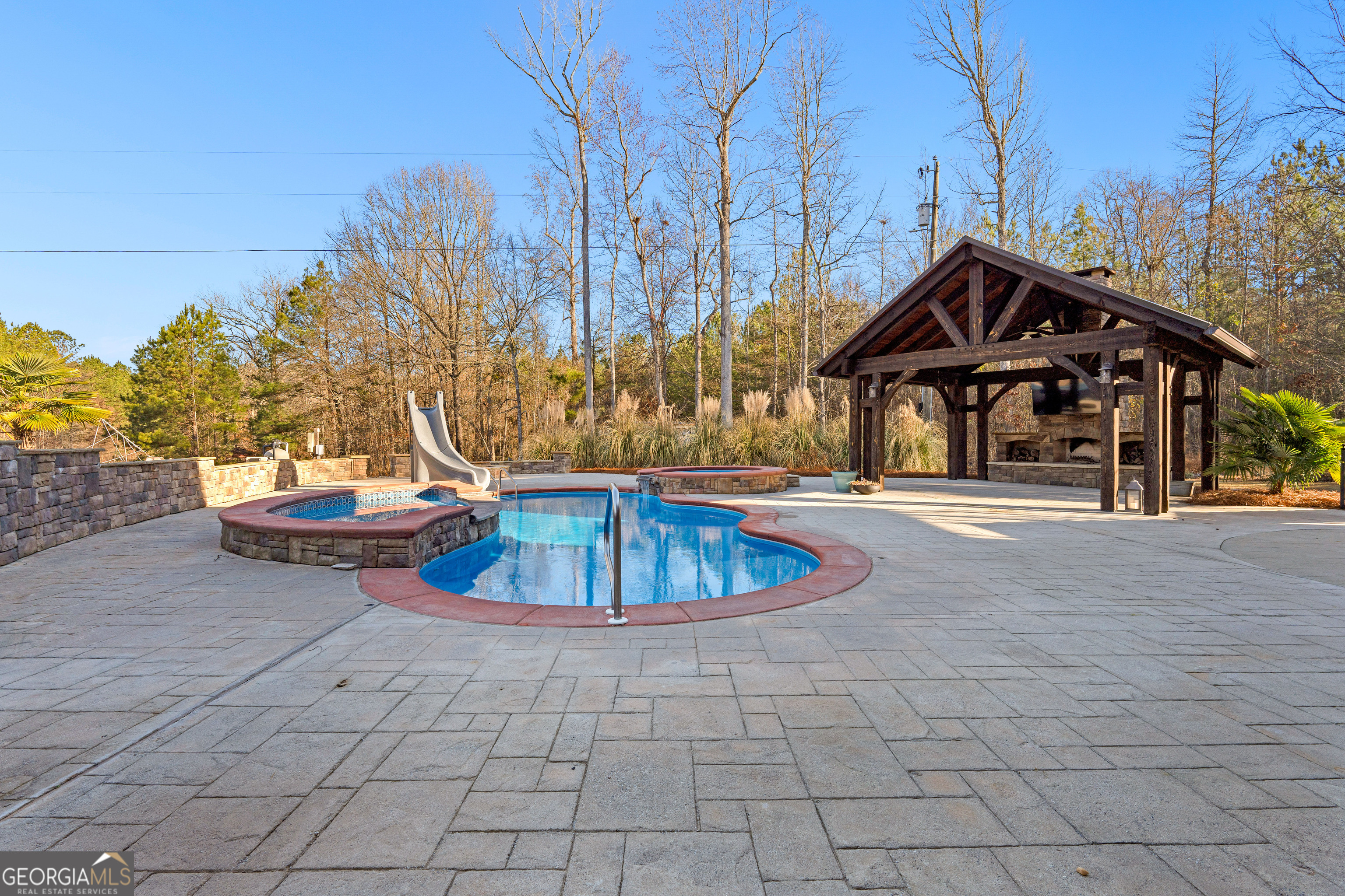 4101 West Ellis Road Griffin, GA 30223 - Photo 105 of 133 a front view of a house with a garden and trees