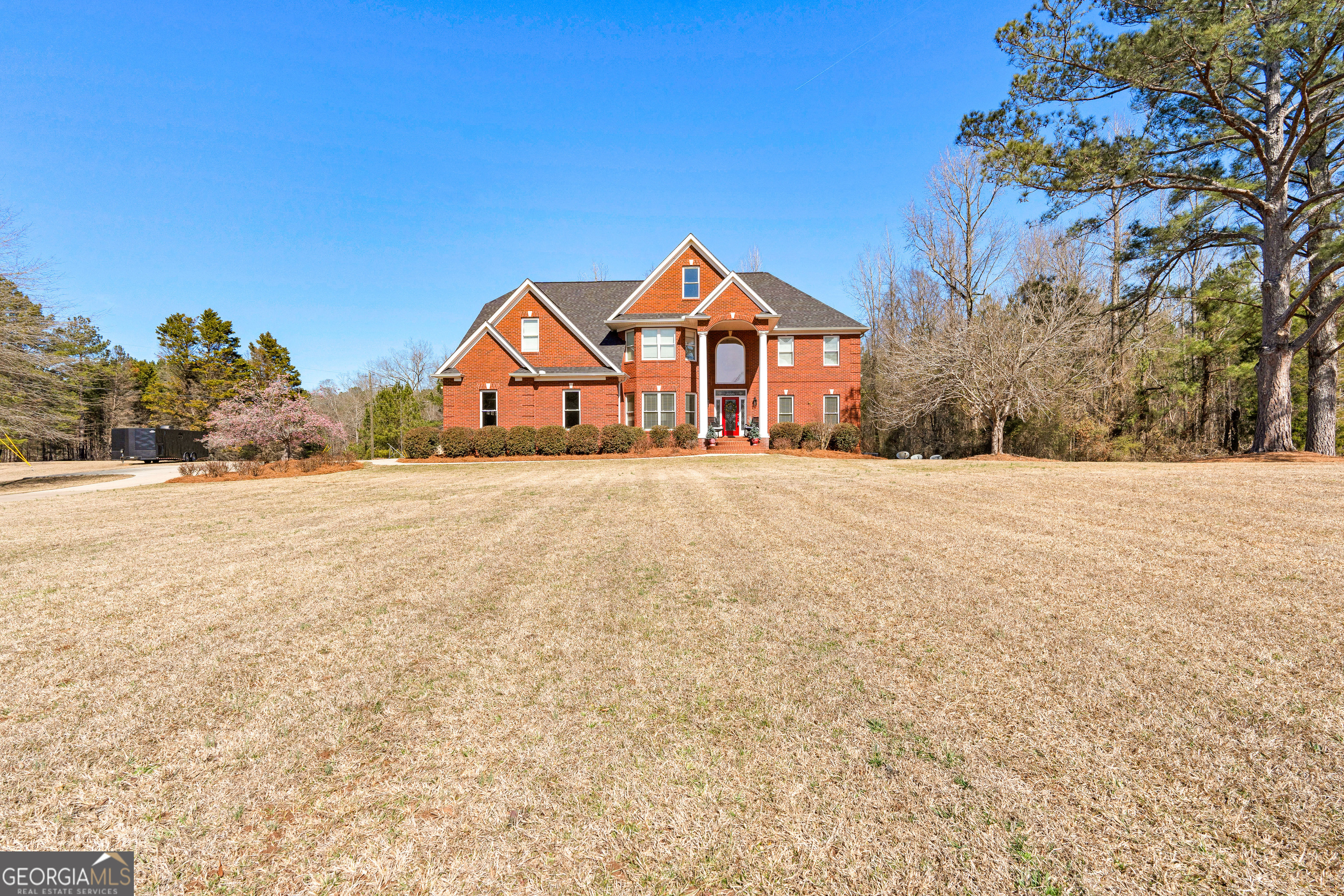 4101 West Ellis Road Griffin, GA 30223 - Photo 126 of 133 a front view of a house with a yard and garage