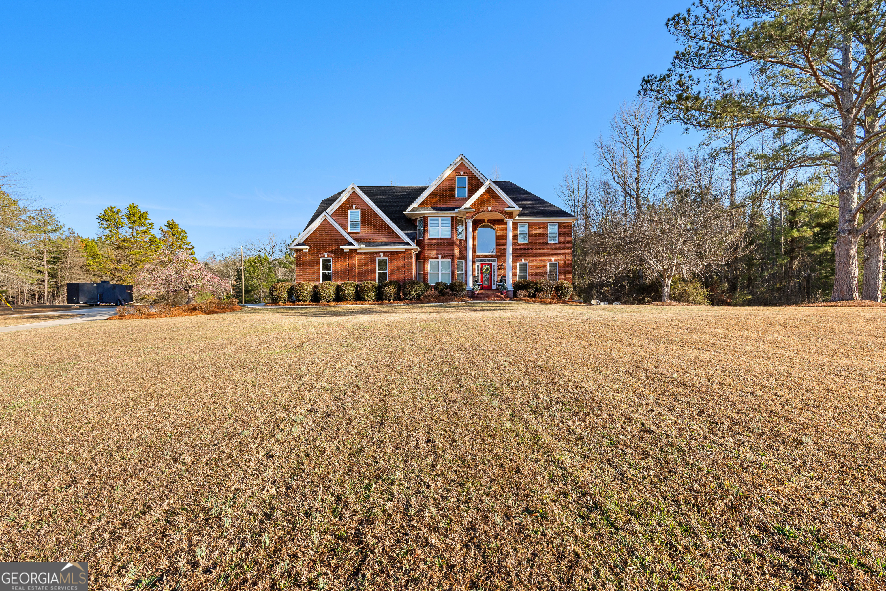 4101 West Ellis Road Griffin, GA 30223 - Photo 129 of 133 a front view of a house with a yard and garage