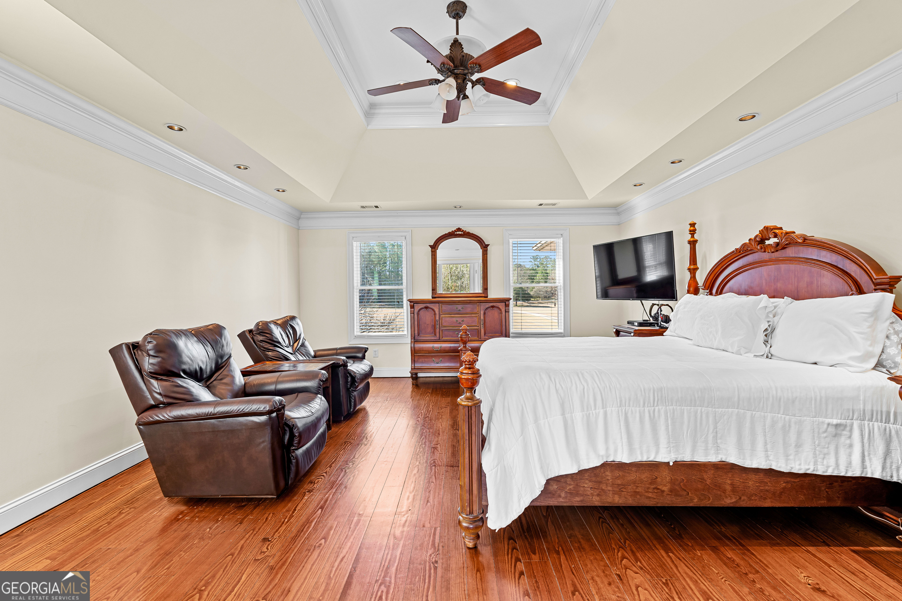 4101 West Ellis Road Griffin, GA 30223 - Photo 42 of 133 a living room with furniture ceiling fan and wooden floor