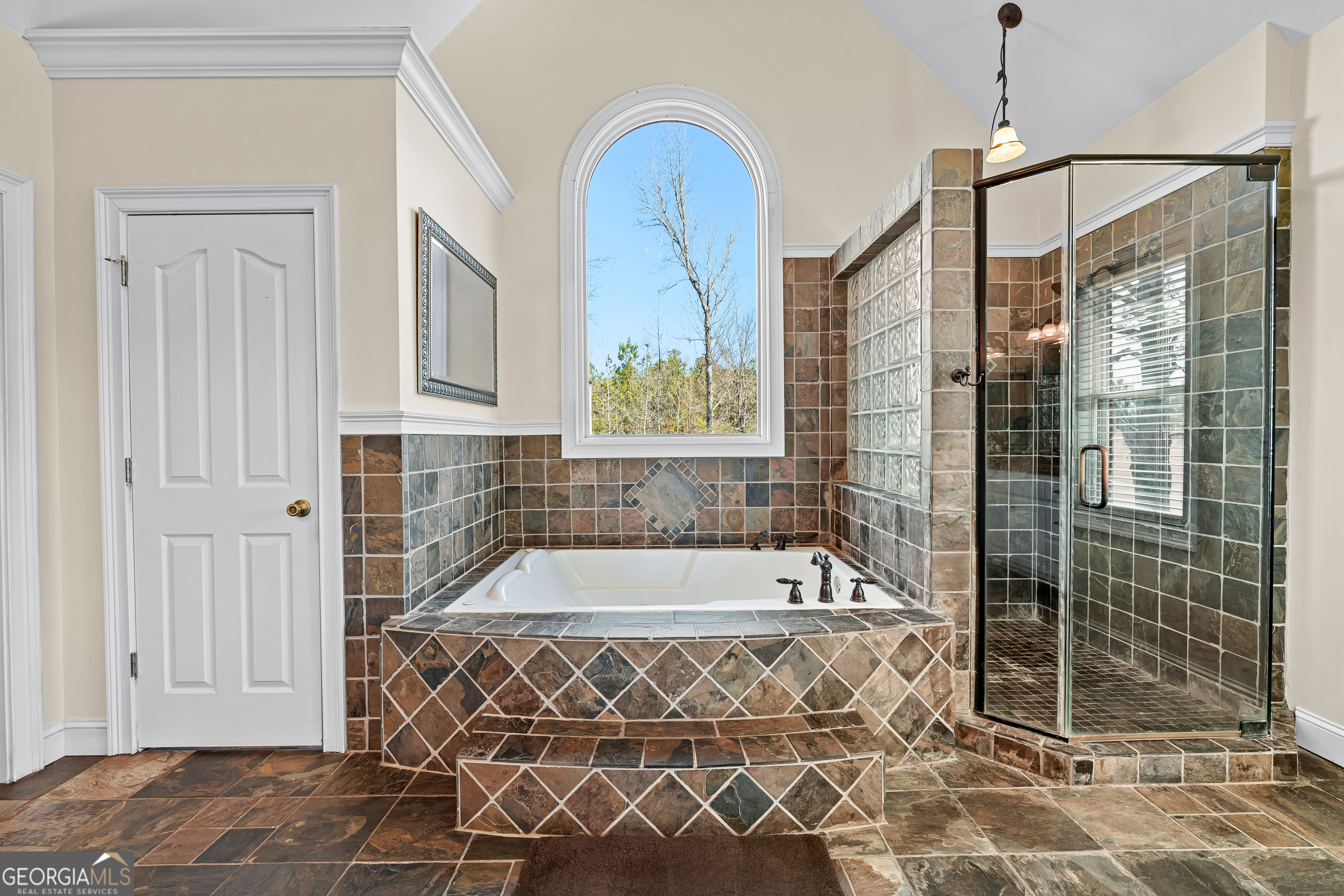 4101 West Ellis Road Griffin, GA 30223 - Photo 45 of 133 a bathroom with a bathtub and shower