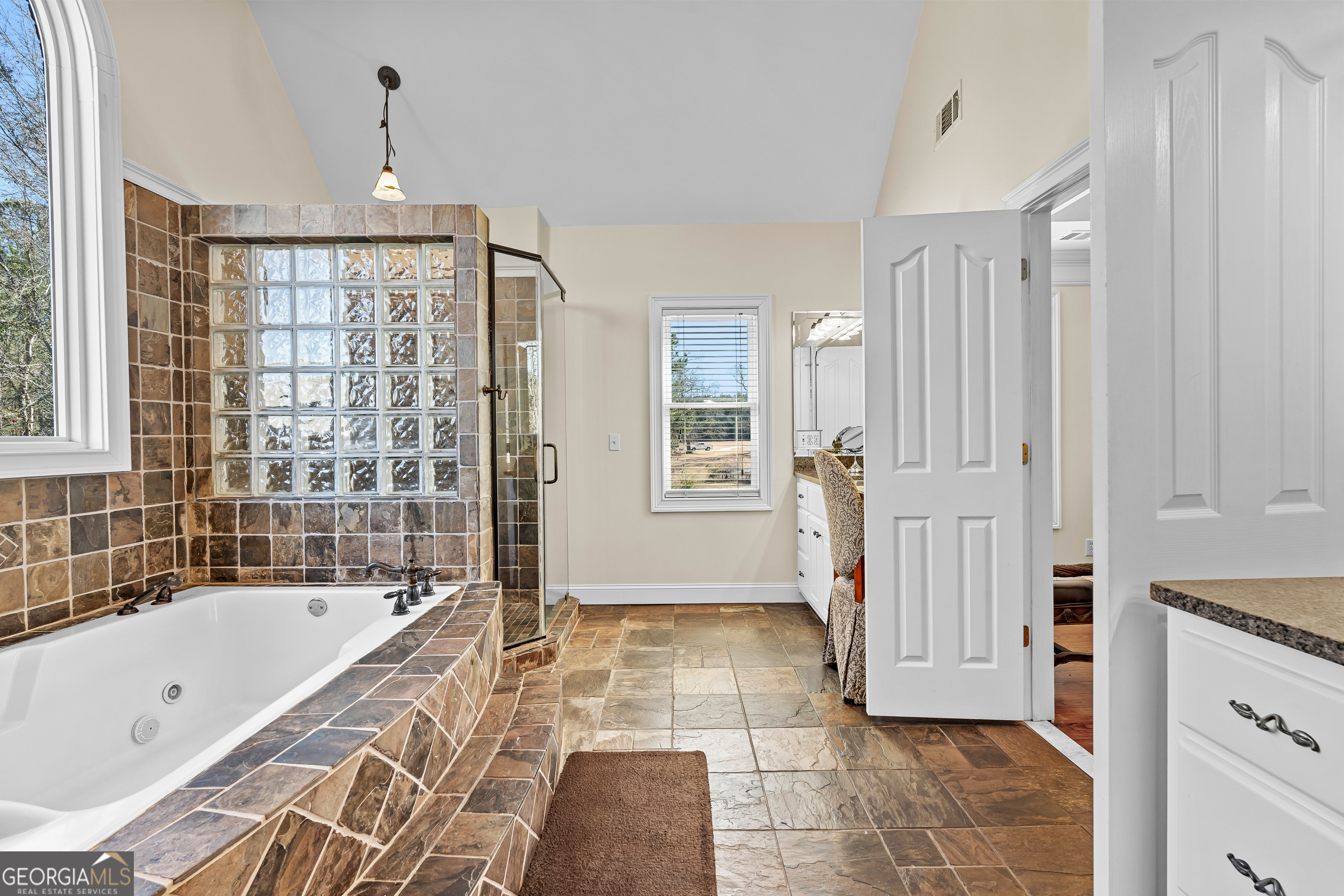 4101 West Ellis Road Griffin, GA 30223 - Photo 46 of 133 a spacious bathroom with a tub shower and sink