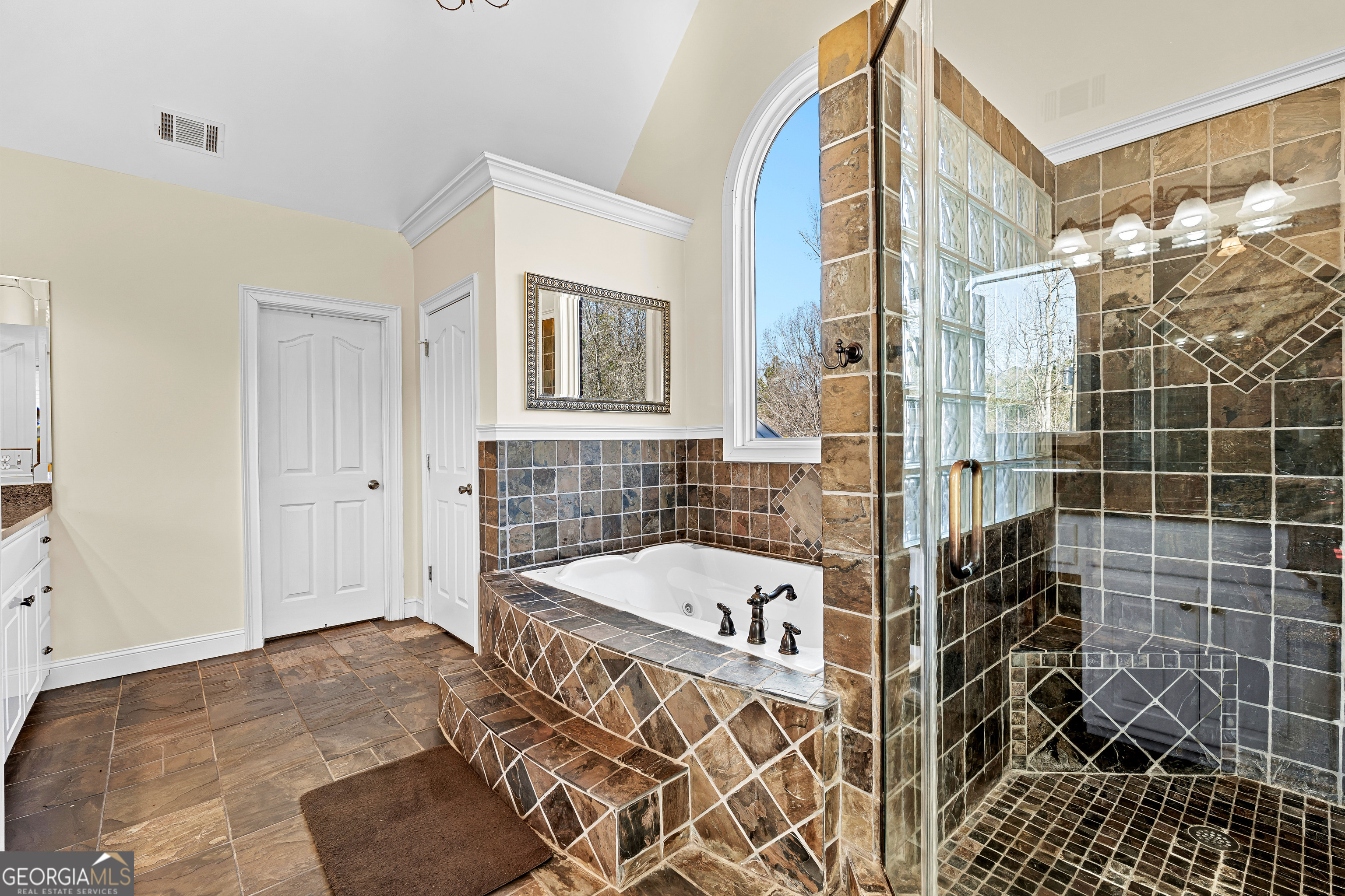 4101 West Ellis Road Griffin, GA 30223 - Photo 48 of 133 a bathroom with a bathtub and shower