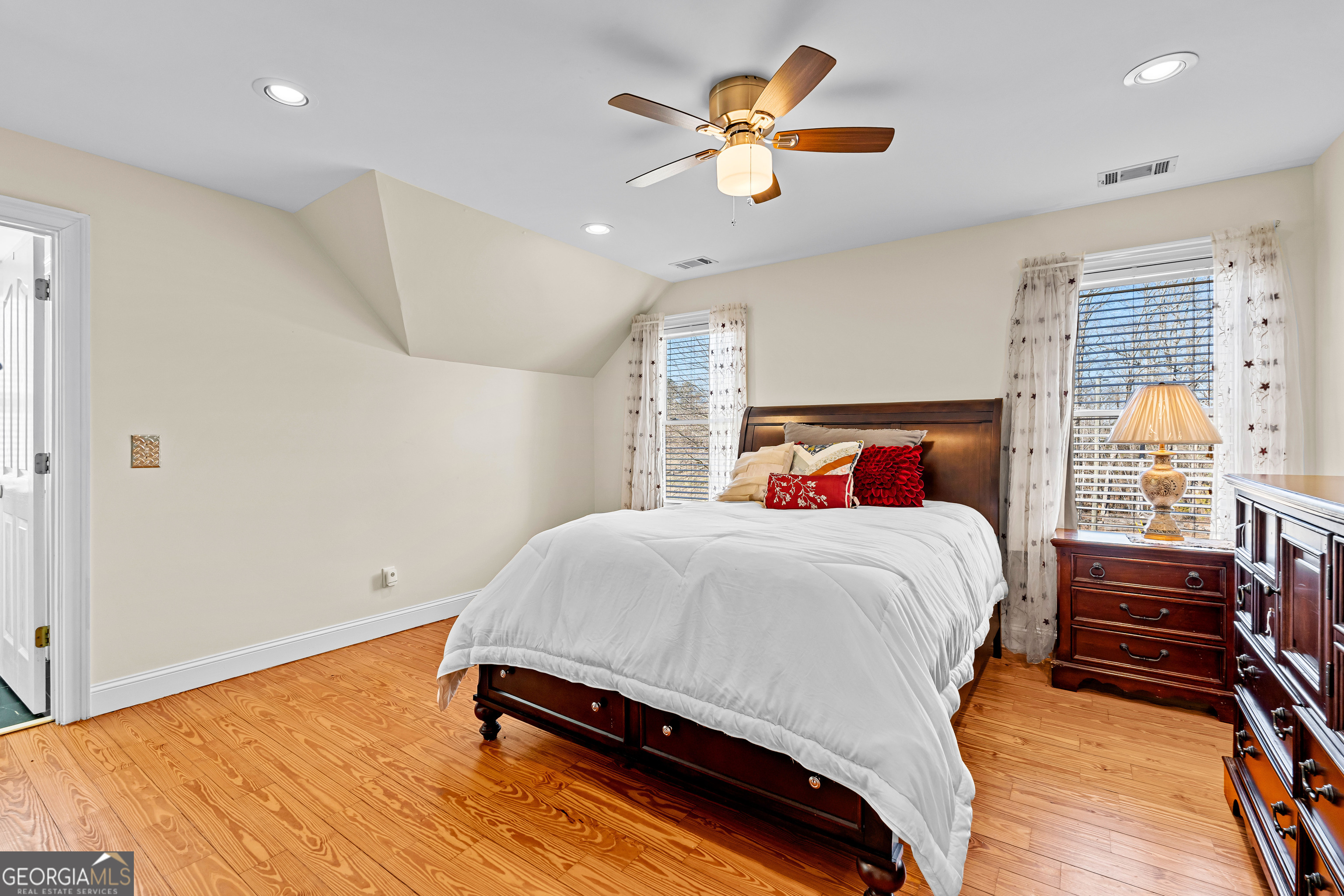 4101 West Ellis Road Griffin, GA 30223 - Photo 50 of 133 a bedroom with a bed and a chandelier