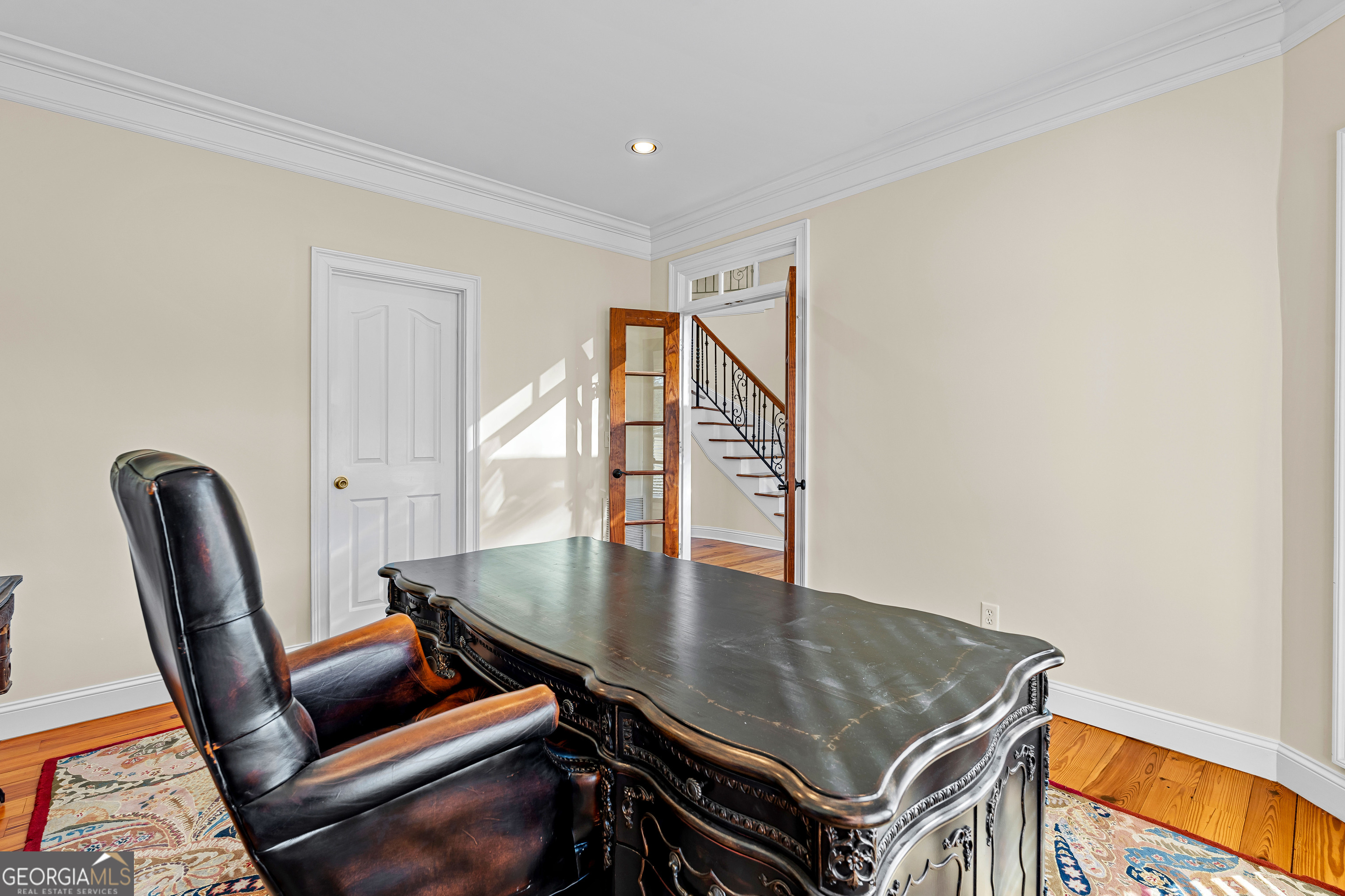 4101 West Ellis Road Griffin, GA 30223 - Photo 70 of 133 a living room with chairs and a table with wooden floor