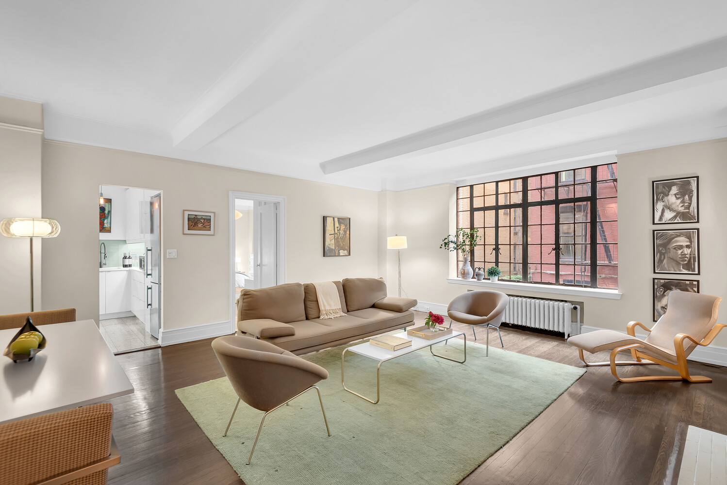 175 East 79th Street, Unit 2C Manhattan, NY 10075 - Photo 12 of 17 a living room with furniture and large windows