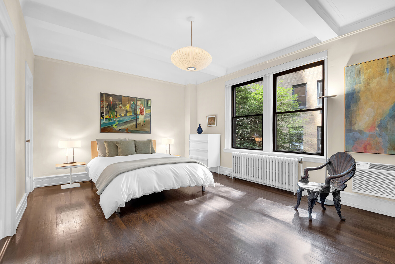 175 East 79th Street, Unit 2C Manhattan, NY 10075 - Photo 14 of 17 a bedroom with a bed and a large window