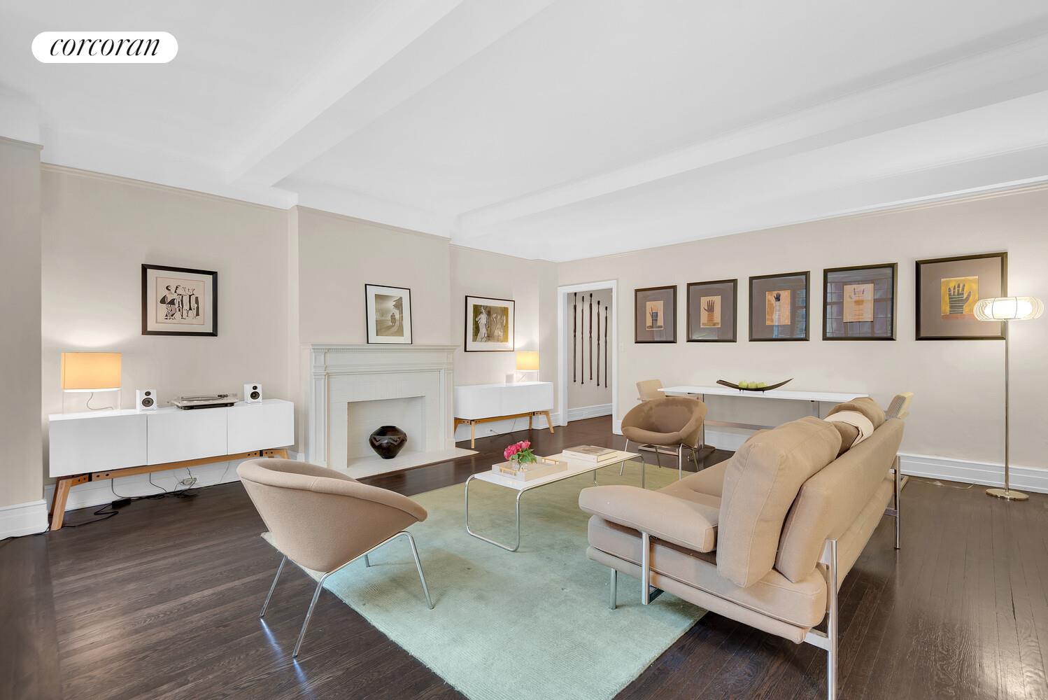 175 East 79th Street, Unit 2C Manhattan, NY 10075 - Photo 2 of 17 a living room with furniture and wooden floor