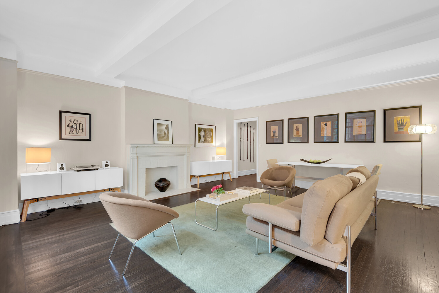 175 East 79th Street, Unit 2C Manhattan, NY 10075 - Photo 6 of 17 a living room with furniture and wooden floor