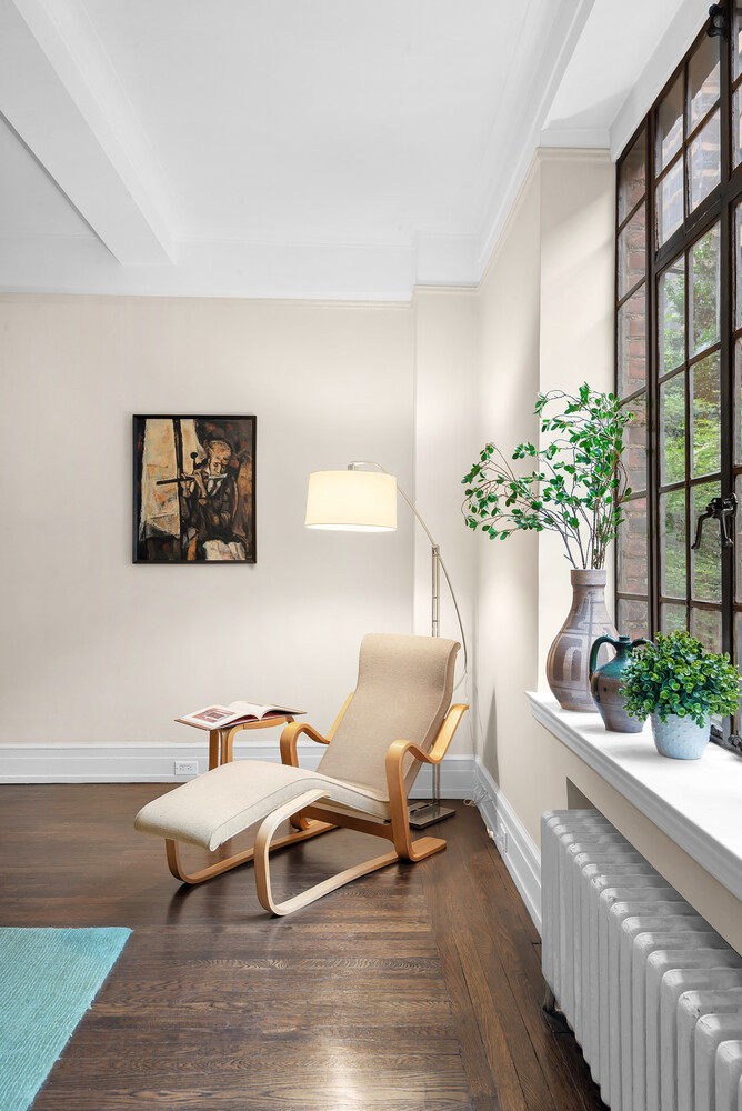 175 East 79th Street, Unit 2C Manhattan, NY 10075 - Photo 9 of 17 a living room with furniture and flowers
