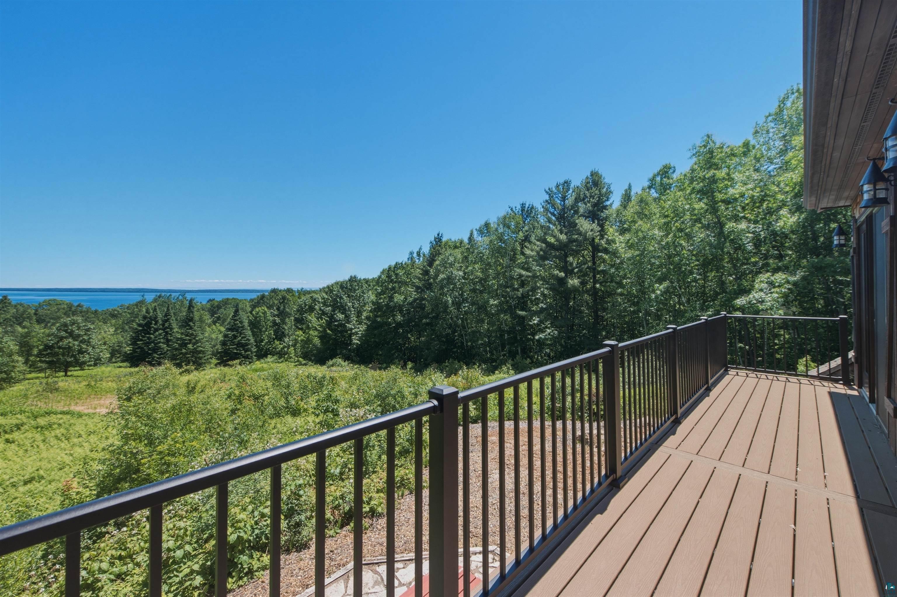 86270 Meyers-Olson Road Bayfield, WI 54814 - Photo 9 of 33 Spacious outdoor deck featuring composite decking and black metal railings