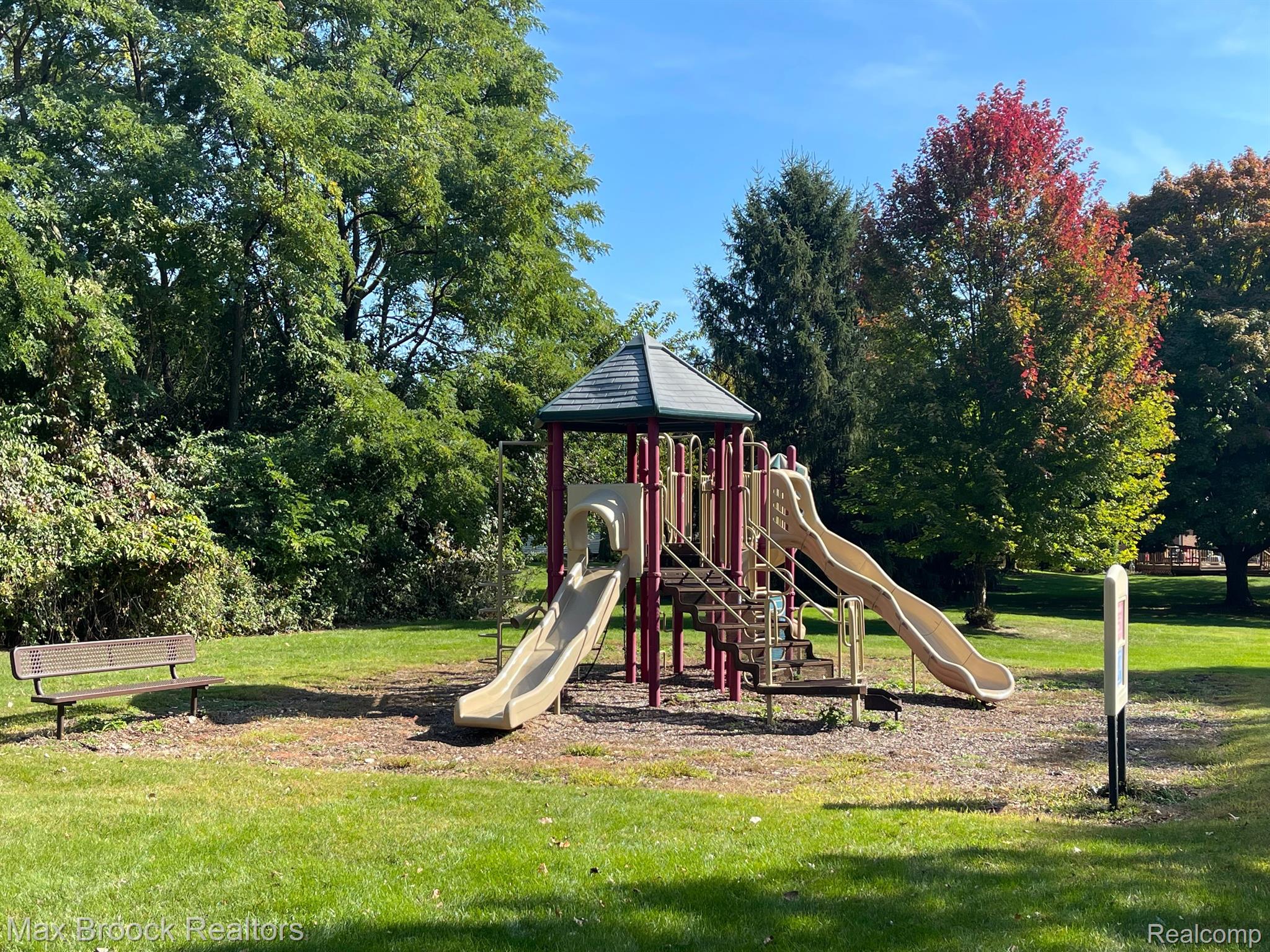 954 Hadley Road Rochester, MI 48307 - Photo 35 of 43 Playground with benches in Heatherwood Village