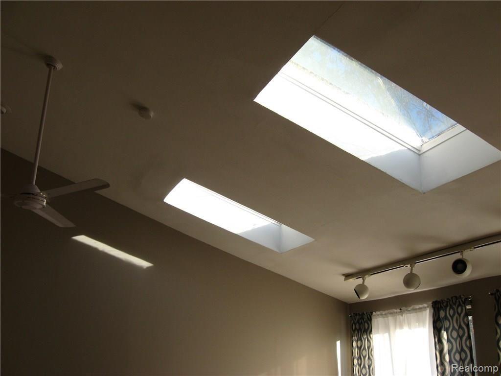 9155 Rucker Road Grosse Ile, MI 48138 - Photo 20 of 31 Vaulted ceiling with sky lights in master bedroom