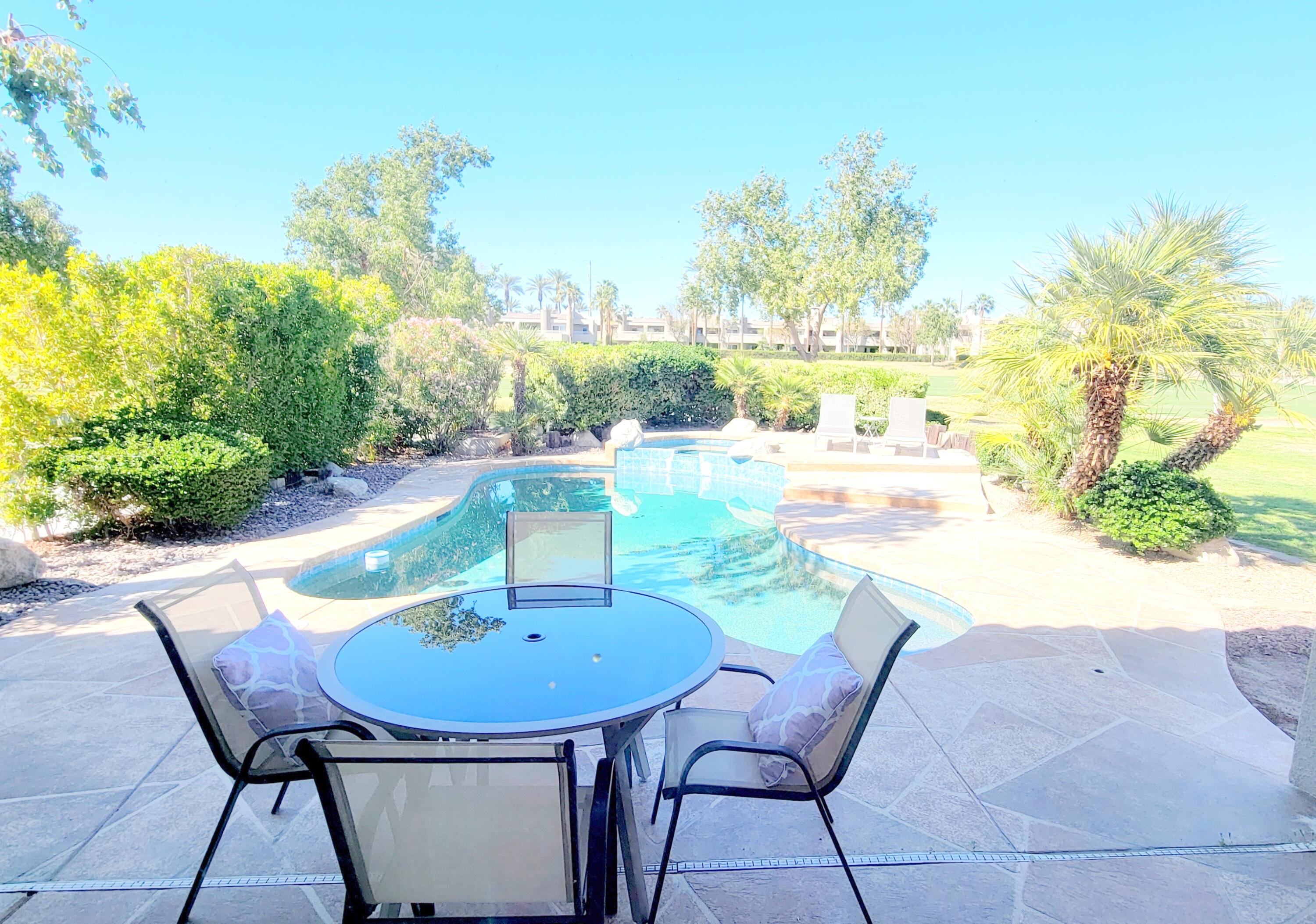 22 Pebble Beach Drive Rancho Mirage, CA 92270 - Photo 4 of 10 a view of a chairs and table in a patio