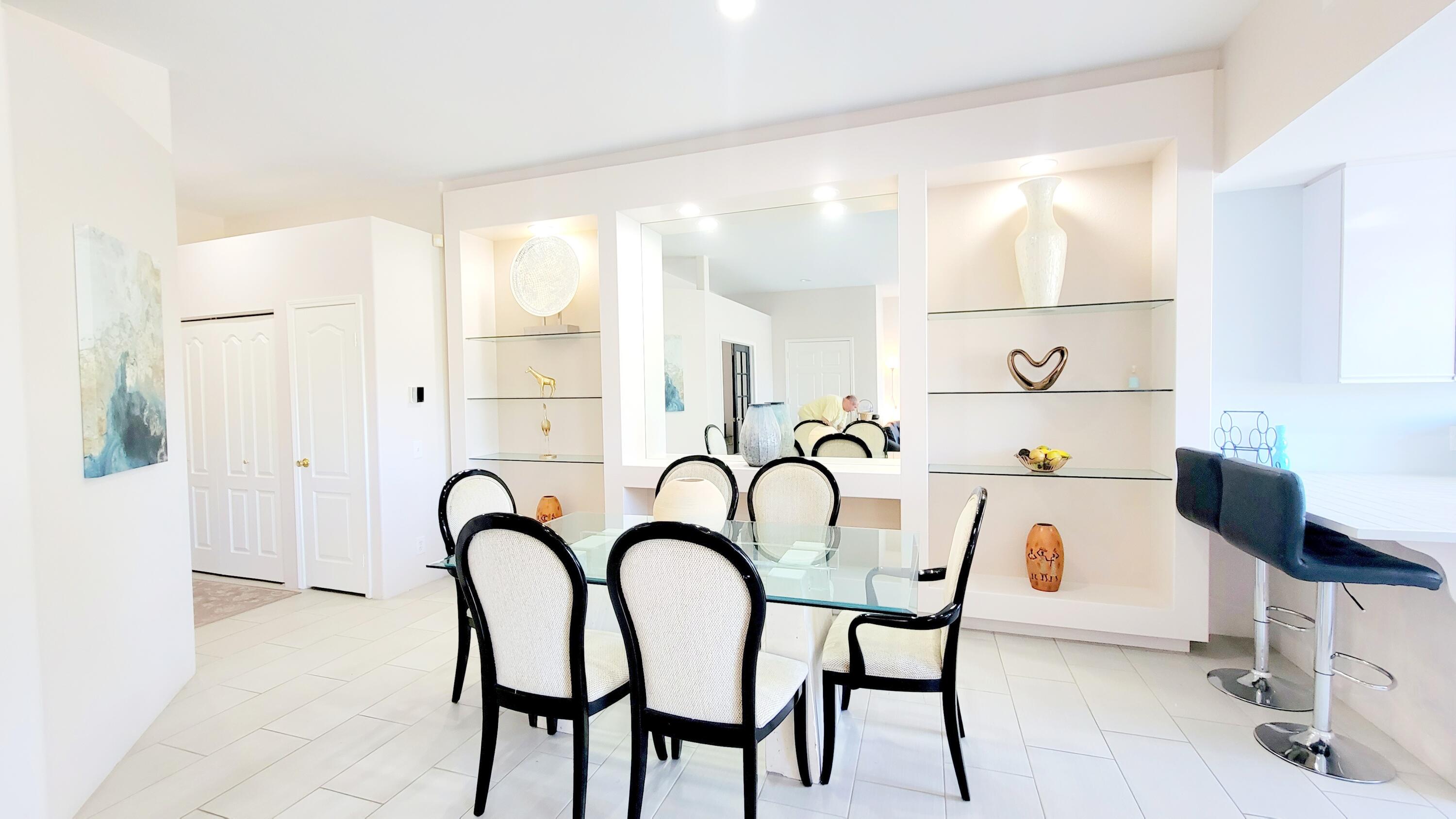22 Pebble Beach Drive Rancho Mirage, CA 92270 - Photo 6 of 10 a kitchen with a table and chairs
