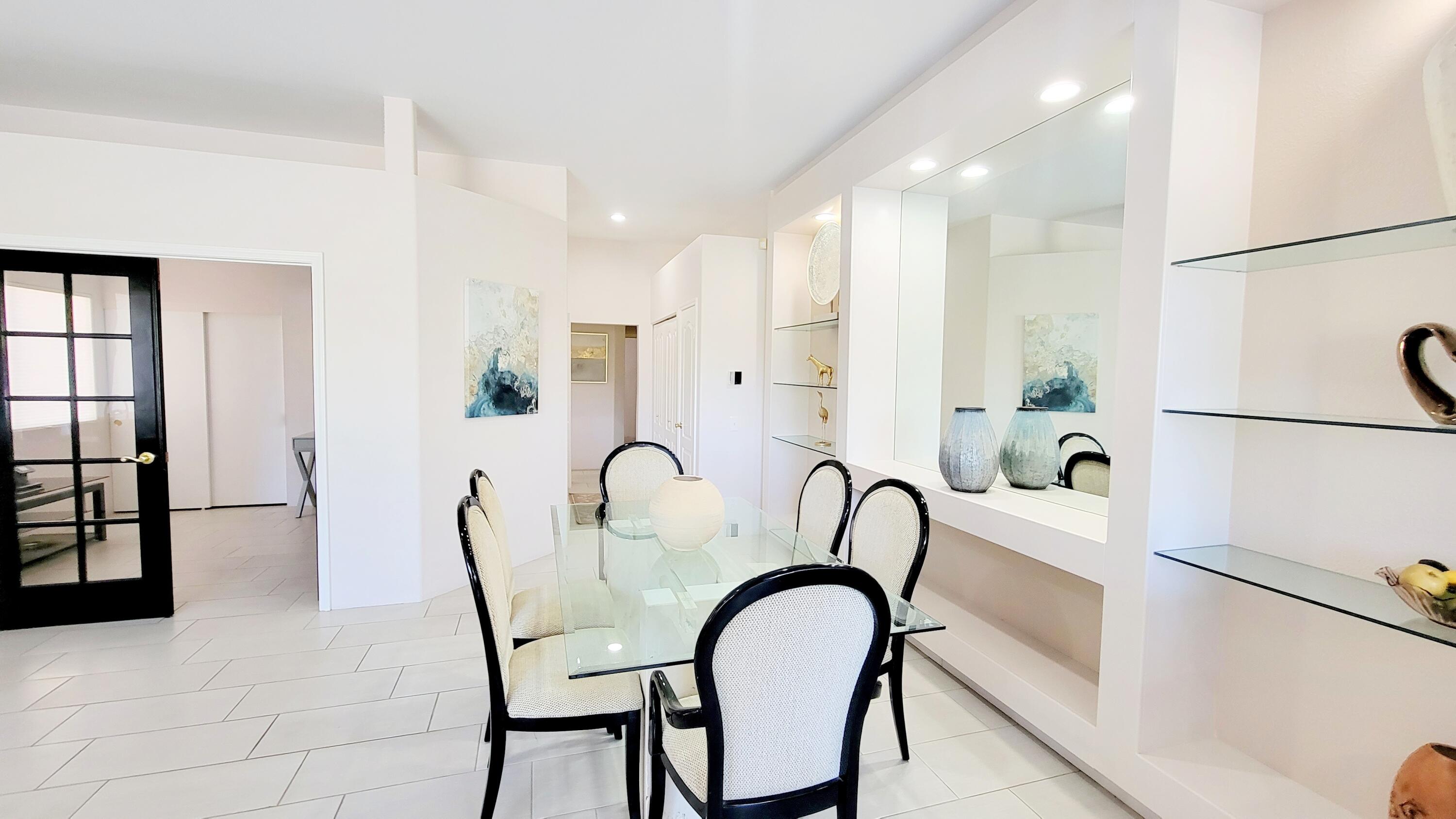 22 Pebble Beach Drive Rancho Mirage, CA 92270 - Photo 7 of 10 a picture of a very nice looking dining room with furniture and a window