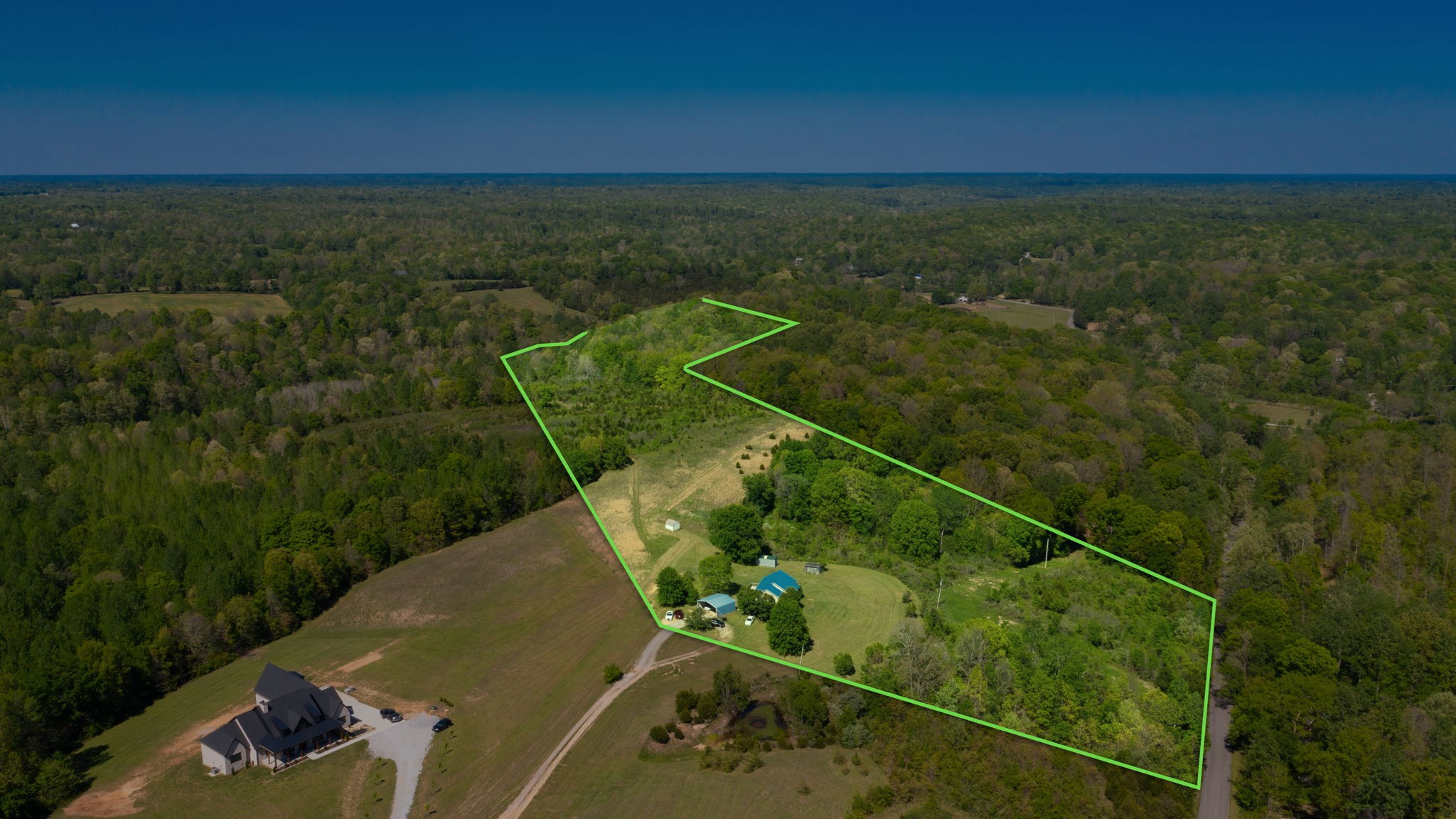 881 Coaling Road Charlotte, TN 37036 - Photo 3 of 29 a view of a tennis court