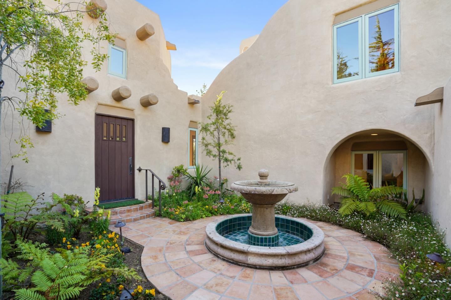 31541 Highway 1 Carmel, CA 93923 - Photo 11 of 73 a view of a house with plants and a potted plant