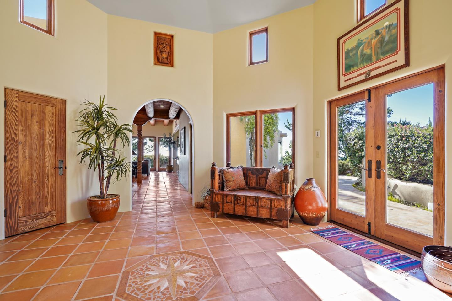 31541 Highway 1 Carmel, CA 93923 - Photo 12 of 73 a living room with furniture a rug and a floor to ceiling window