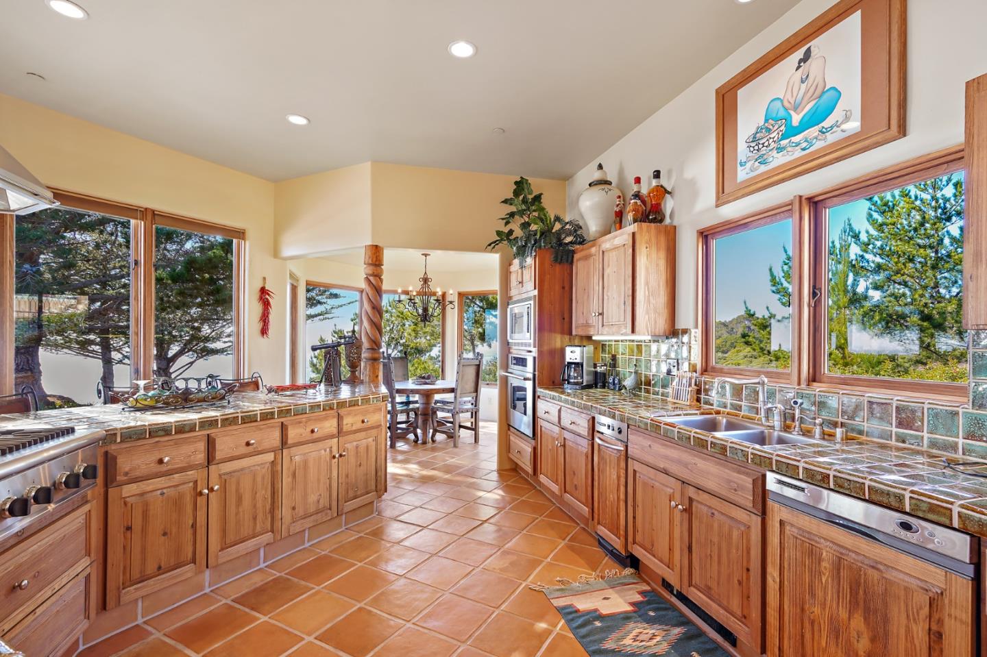 31541 Highway 1 Carmel, CA 93923 - Photo 19 of 73 a large kitchen with stainless steel appliances a sink and cabinets