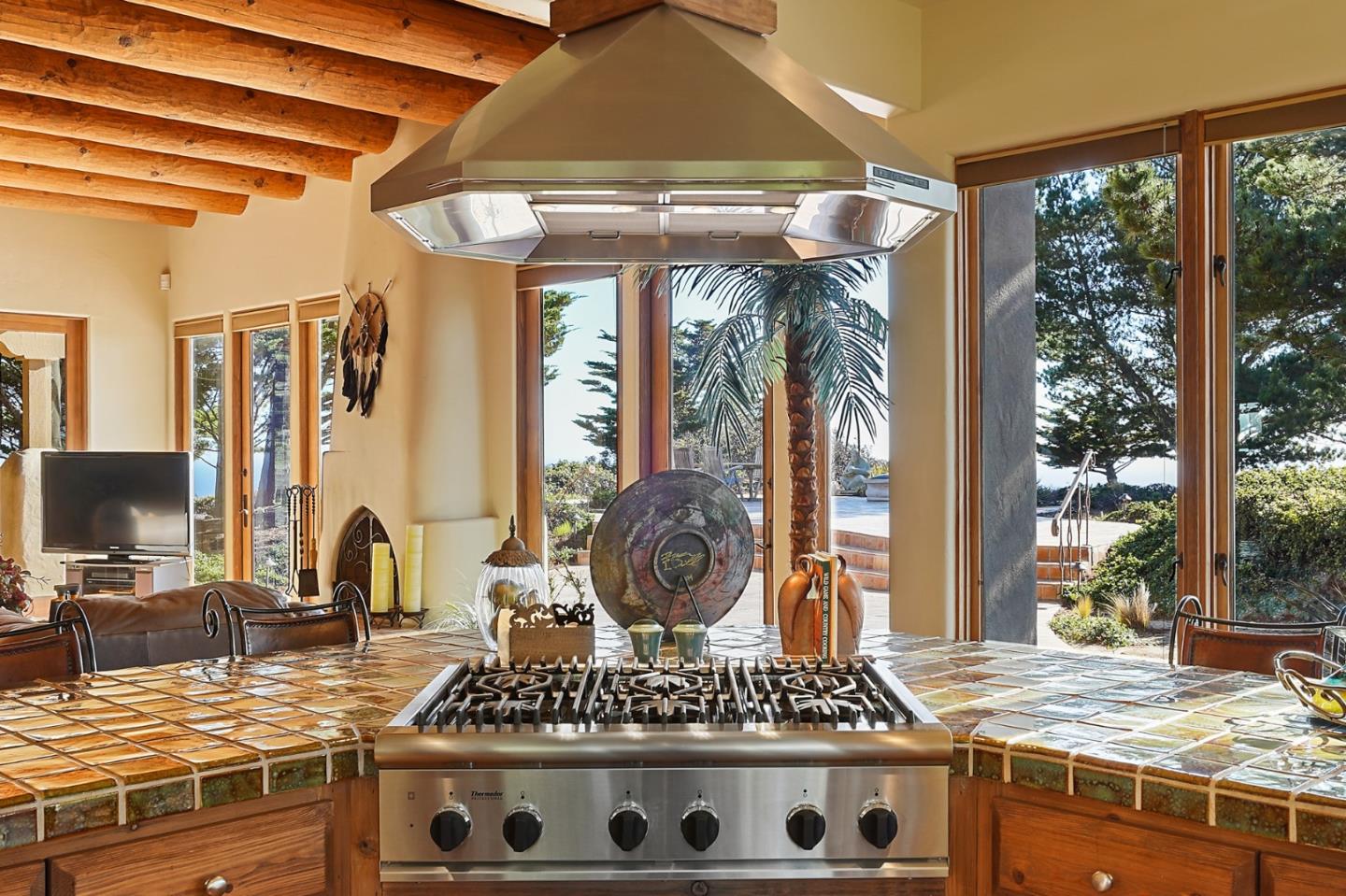 31541 Highway 1 Carmel, CA 93923 - Photo 27 of 73 a kitchen with a stove a sink and a wooden cabinets