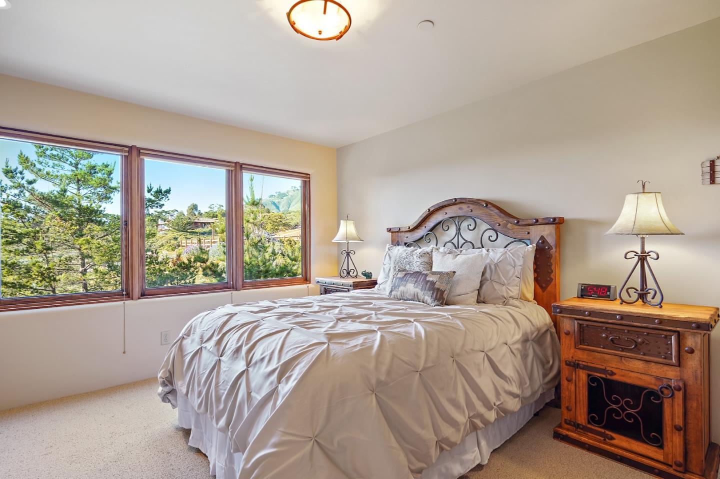31541 Highway 1 Carmel, CA 93923 - Photo 47 of 73 a bedroom with a bed and a window