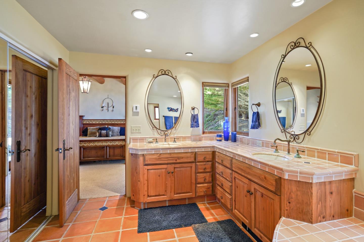 31541 Highway 1 Carmel, CA 93923 - Photo 56 of 73 a large bathroom with a double vanity sink a mirror and a shower
