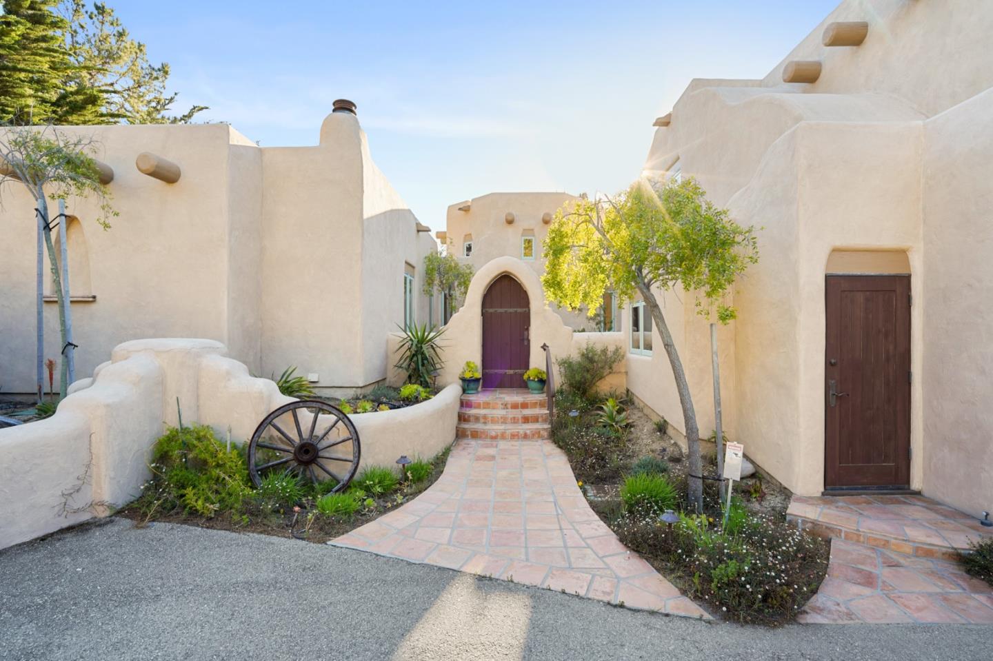31541 Highway 1 Carmel, CA 93923 - Photo 9 of 73 a front view of a house with garden and plants