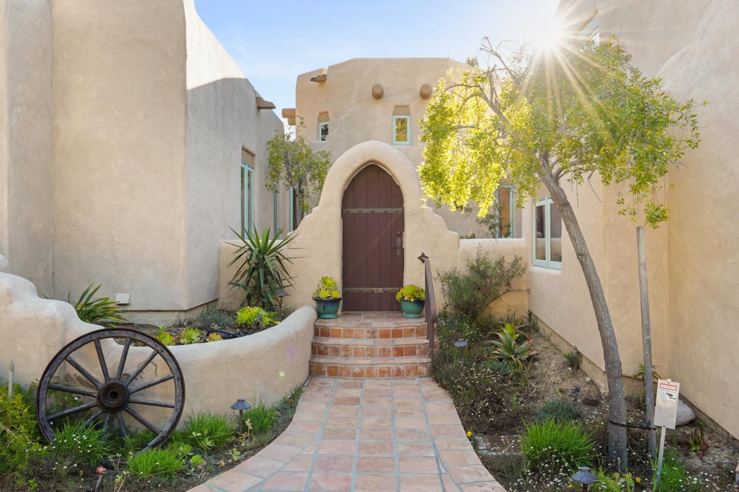 31541 Highway 1 Carmel, CA 93923 - Photo 10 of 73 a front view of a house with garden