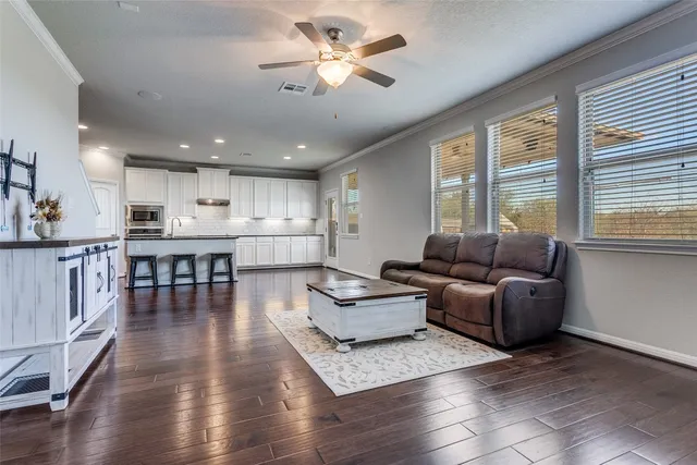 a living room with furniture and a large window