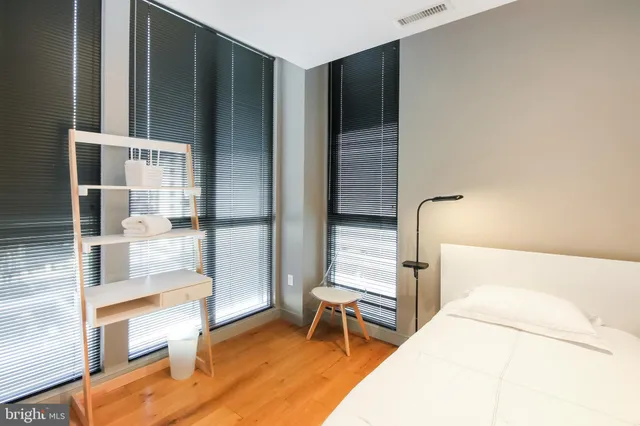 a bed room with a bed and a couch