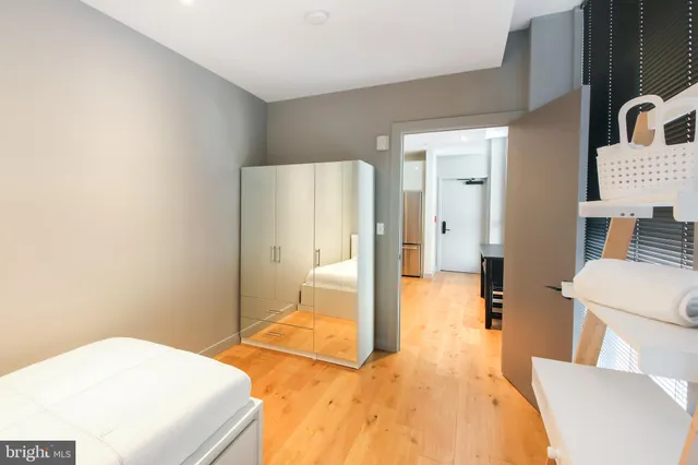 a bedroom with a bed and lamp