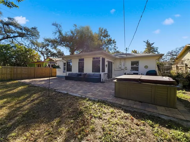a view of a white house with a yard