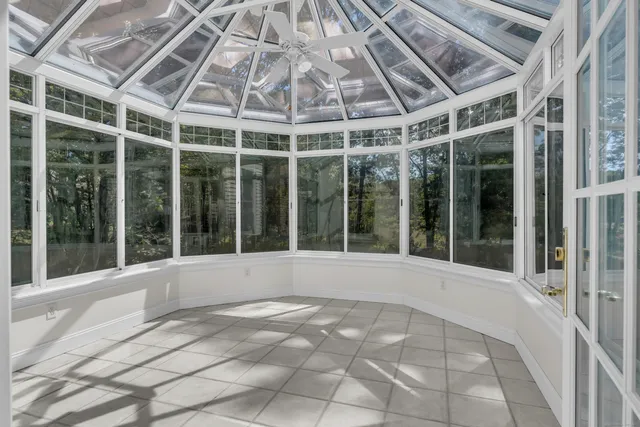 a view of an empty room with a large window