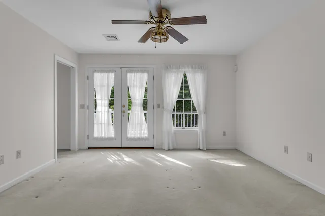 a view of a wooden house with a small yard