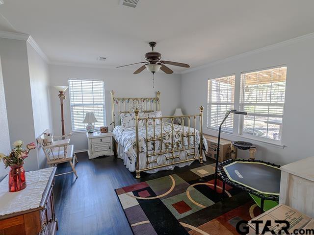 495 Wilcox Drive Rusk, TX 75785 - Photo 27 of 37 a bedroom with furniture window and wooden floor