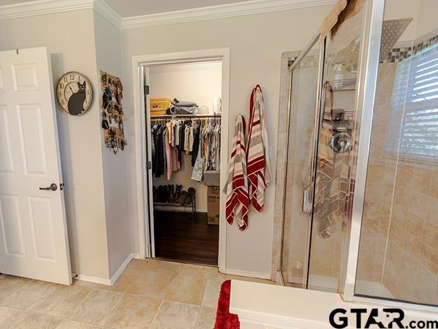 495 Wilcox Drive Rusk, TX 75785 - Photo 32 of 37 a view of walk in closet with clothes and shoes