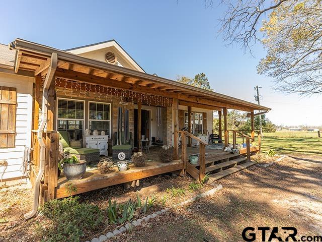 495 Wilcox Drive Rusk, TX 75785 - Photo 7 of 37 a front view of a house with swimming pool and sitting area