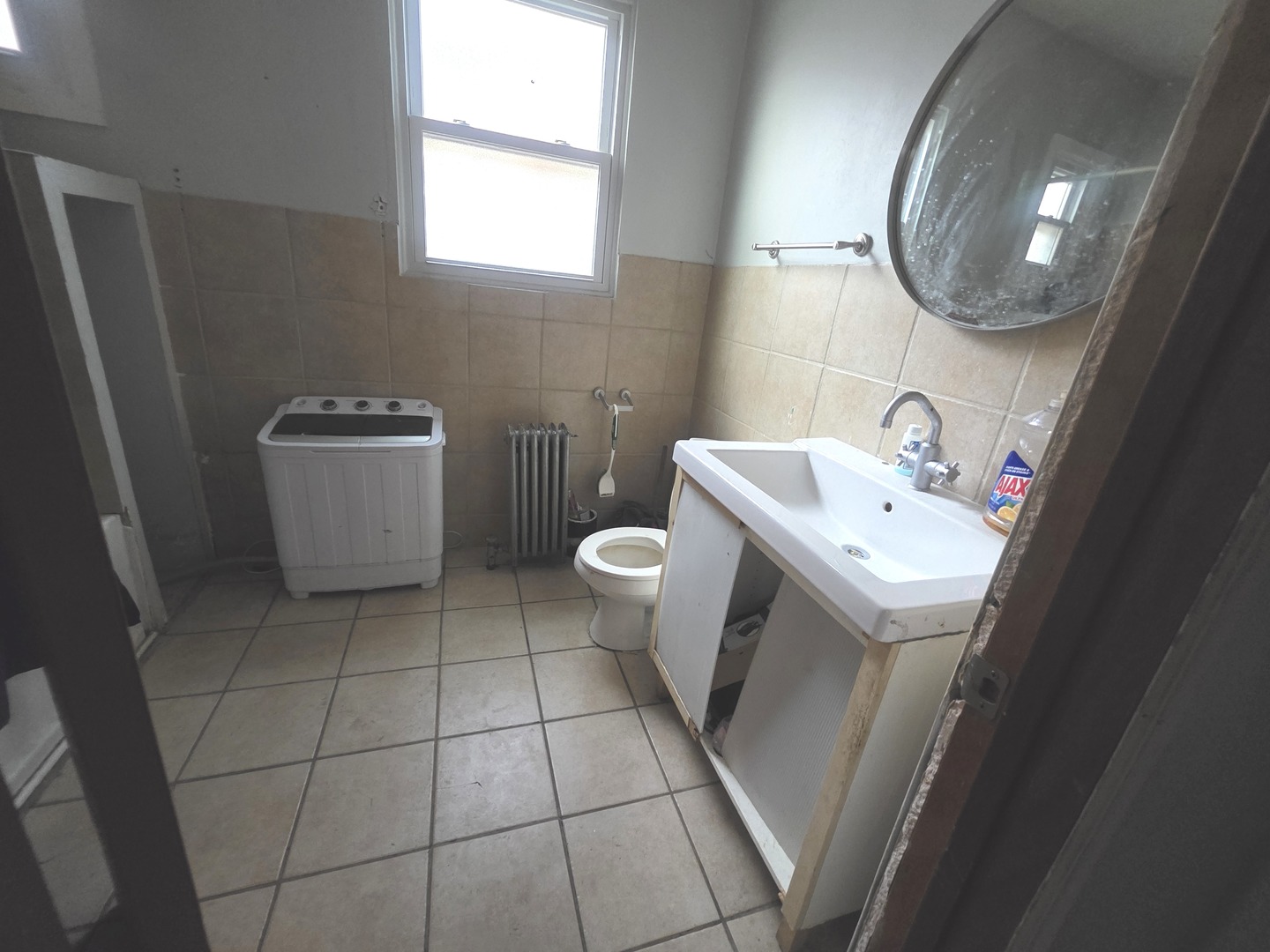 7545 South Merrill Avenue Chicago, IL 60649 - Photo 5 of 12 a bathroom with a sink toilet and mirror