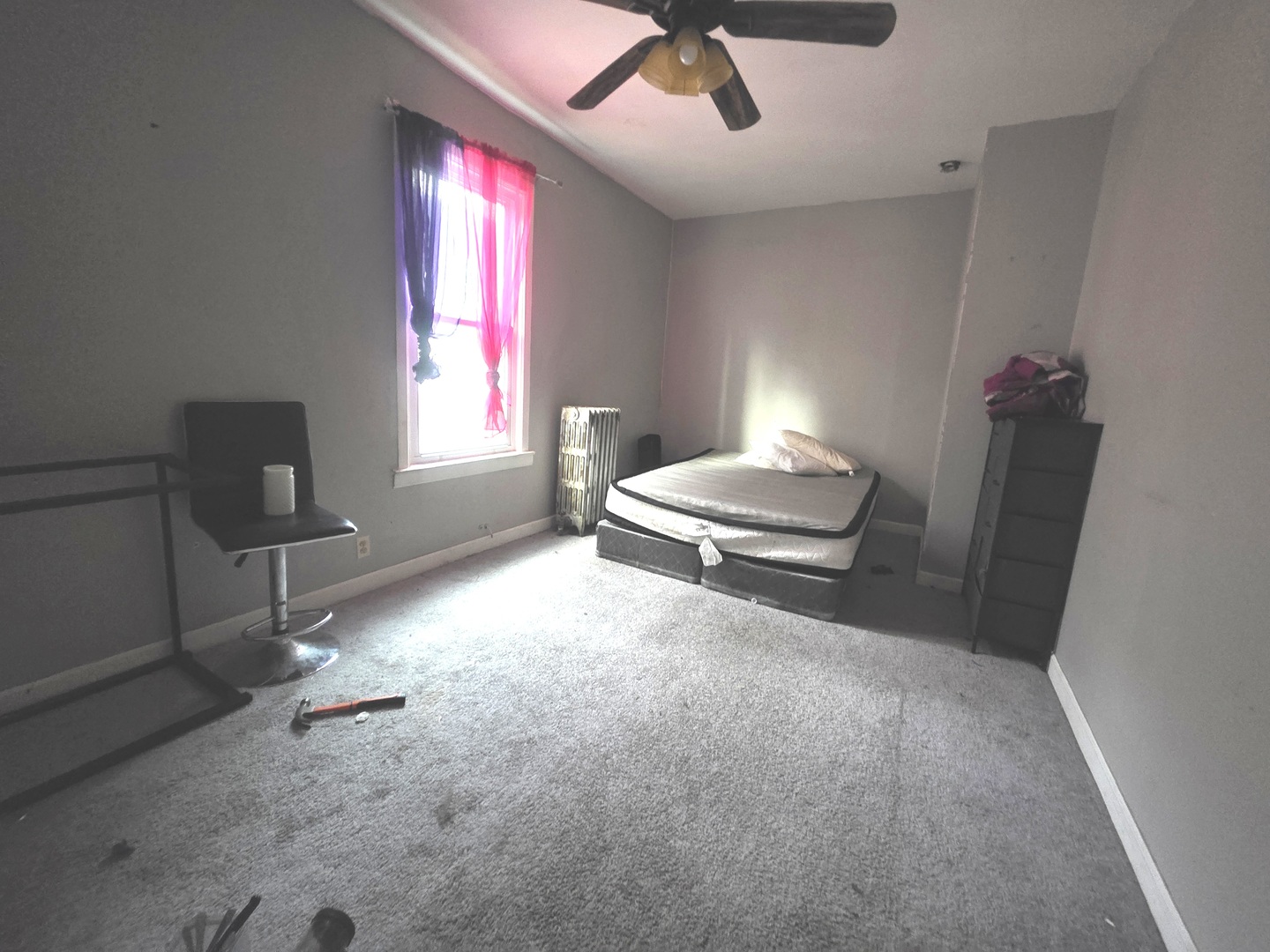 7545 South Merrill Avenue Chicago, IL 60649 - Photo 6 of 12 a bedroom with a bed and window