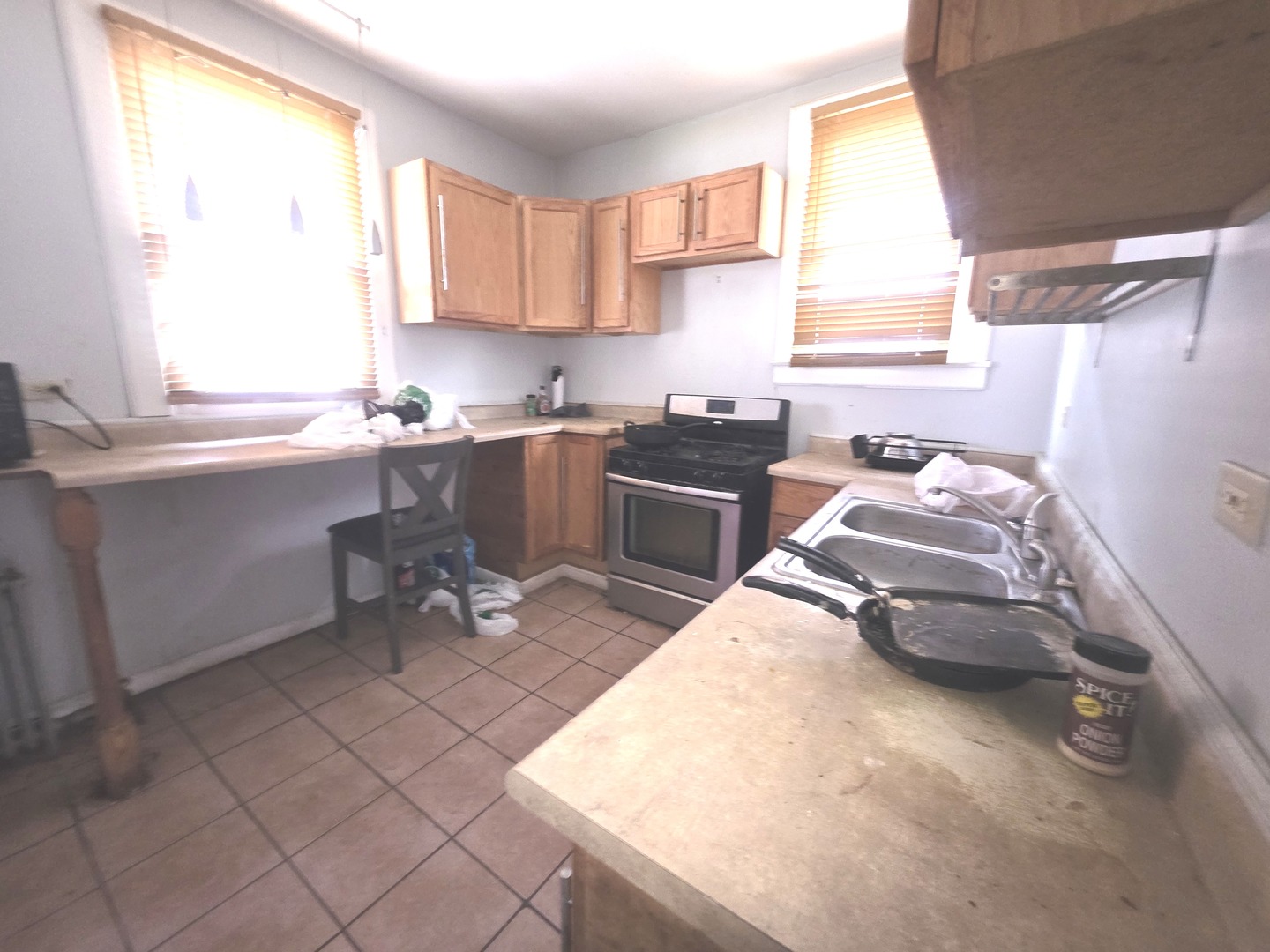 7545 South Merrill Avenue Chicago, IL 60649 - Photo 7 of 12 a kitchen with a sink appliances and a window