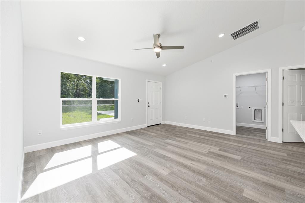 2130 Southwest 159th Court Ocala, FL 34481 - Photo 7 of 27 an empty room with wooden floor and windows
