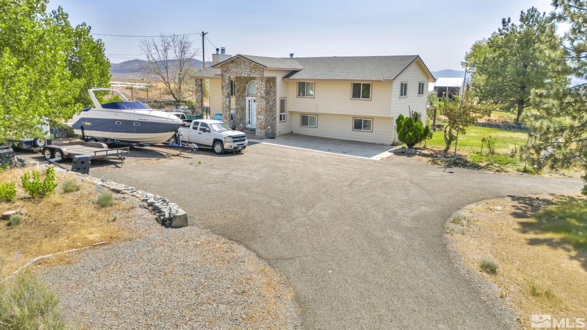12700 North Red Rock Road Reno, NV 89508 - Photo 1 of 40 a view of a house with patio
