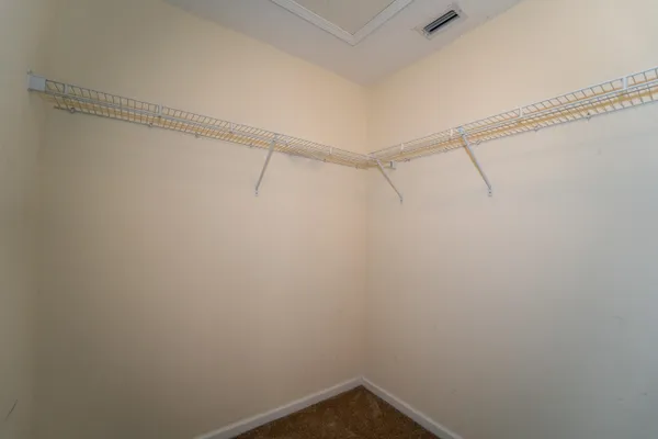 a view of a room with racks on the wall