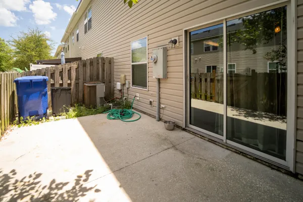 a view of a house with a backyard and balcony