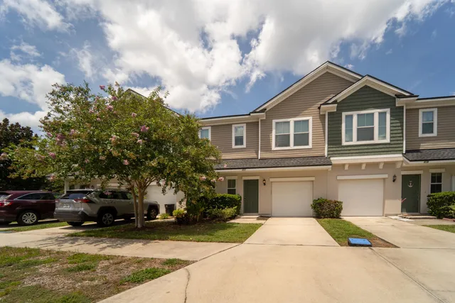 an aerial view of a house with a swimming pool outdoor seating and yard