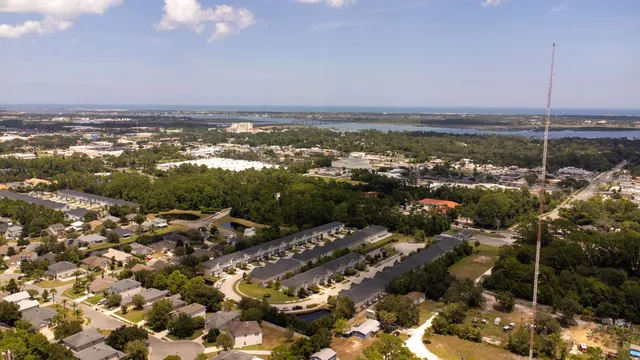 an aerial view of residential house with outdoor space and parking