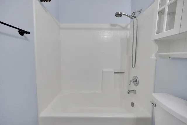 a close up of a bathtub curtain